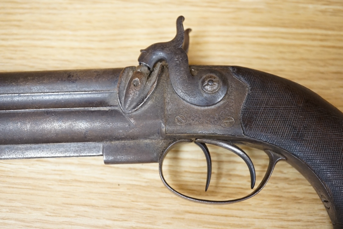 A double barrel over and under 16 bore percussion holster pistol by J. Beattie, barrels 14cm, London proofed, engraved; J. Beattie, Regent Street, London, with foliate engraved boxlock action and finely chequered walnut